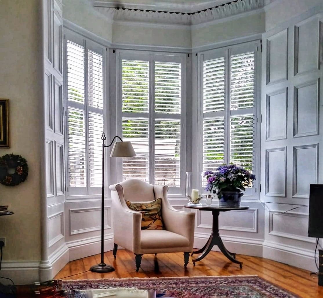 Bay window plantation shutters with angled louvres