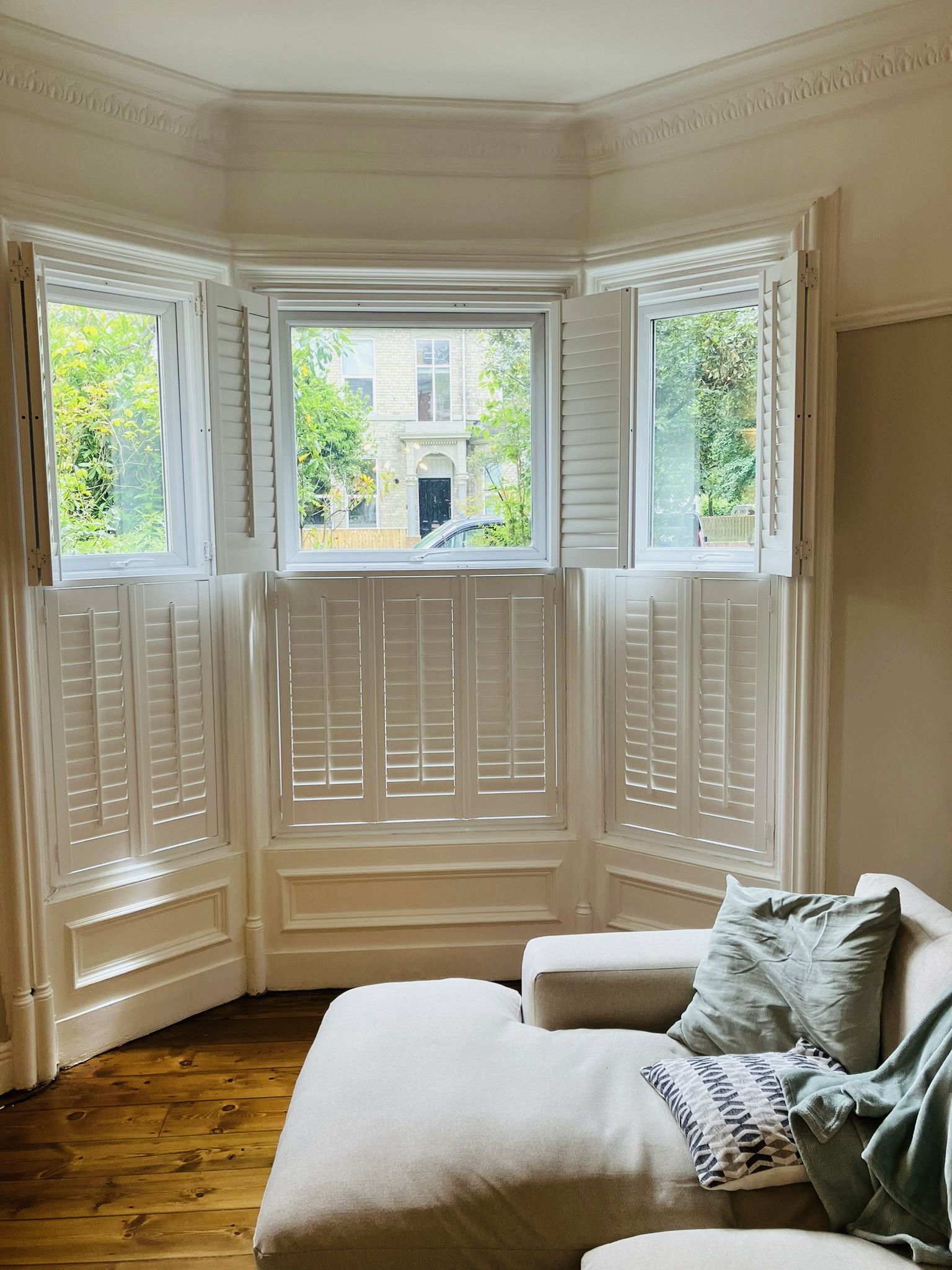 Café-style shutters fitted to a bay window